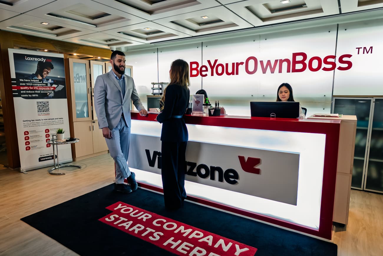 Virtuzone reception area with Be Your Own Boss branding